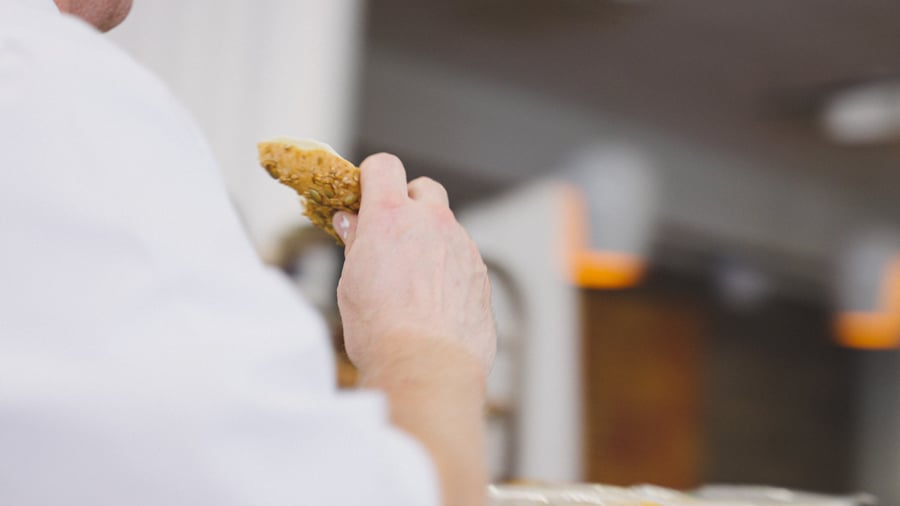 bread-hand-blurry-background